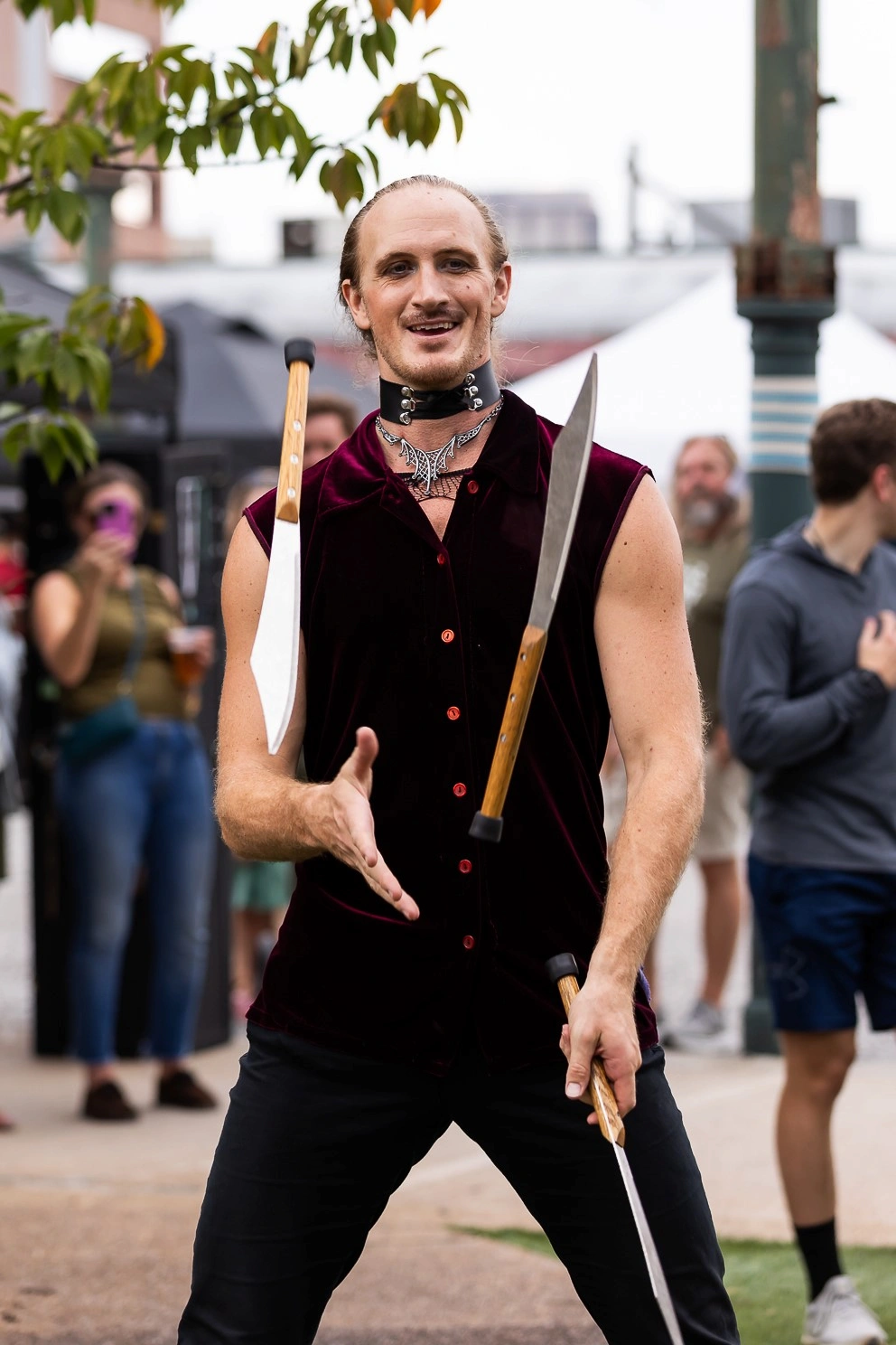 Halloween costume performer juggling knives