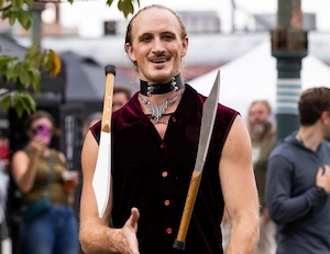 Halloween costume performer juggling knives